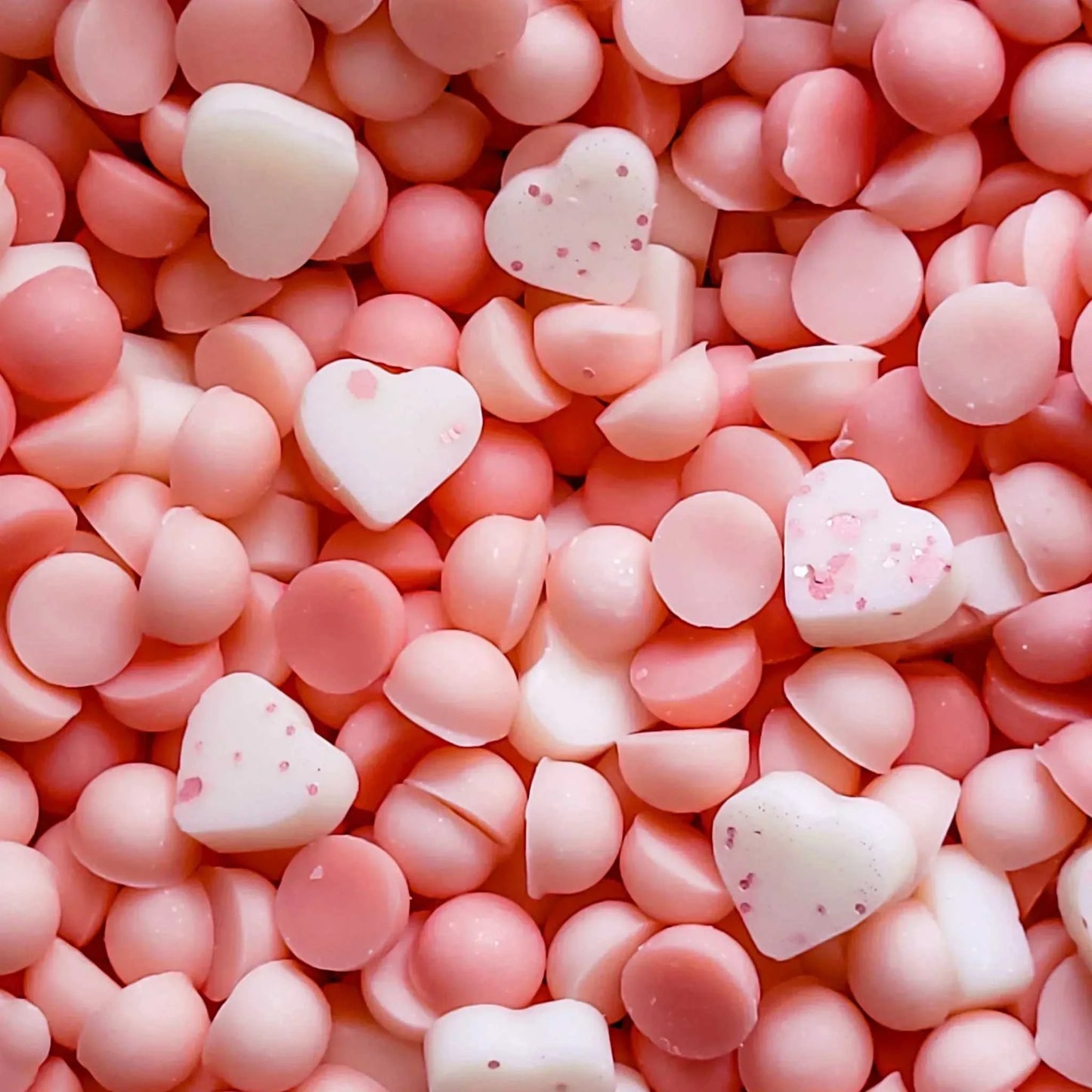 Gratitude wax melts with mandarin, basil leaf, jasmine scents; heart-shaped, pink and white melt pieces.