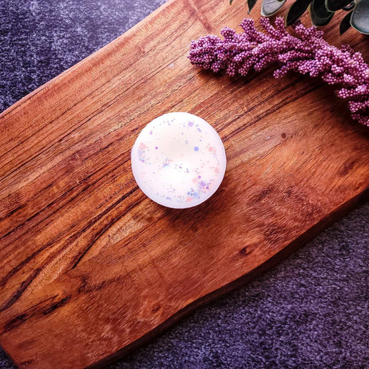 Crisp Cotton Waxmelt with green apple, cedar, and lavender scents on wooden surface.