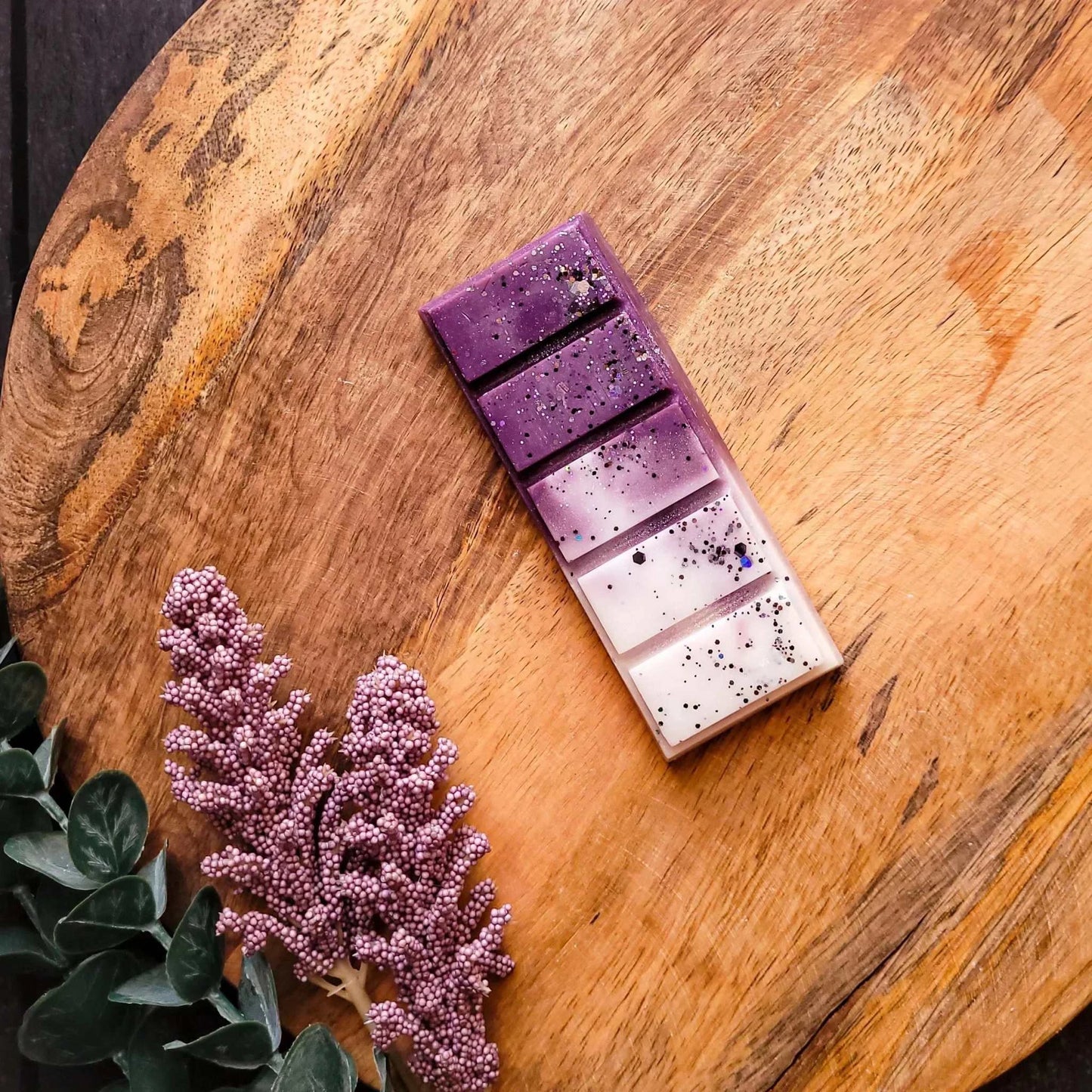 Berries & Cream Waxmelt with raspberry, jasmine, and pink musk on wooden surface.