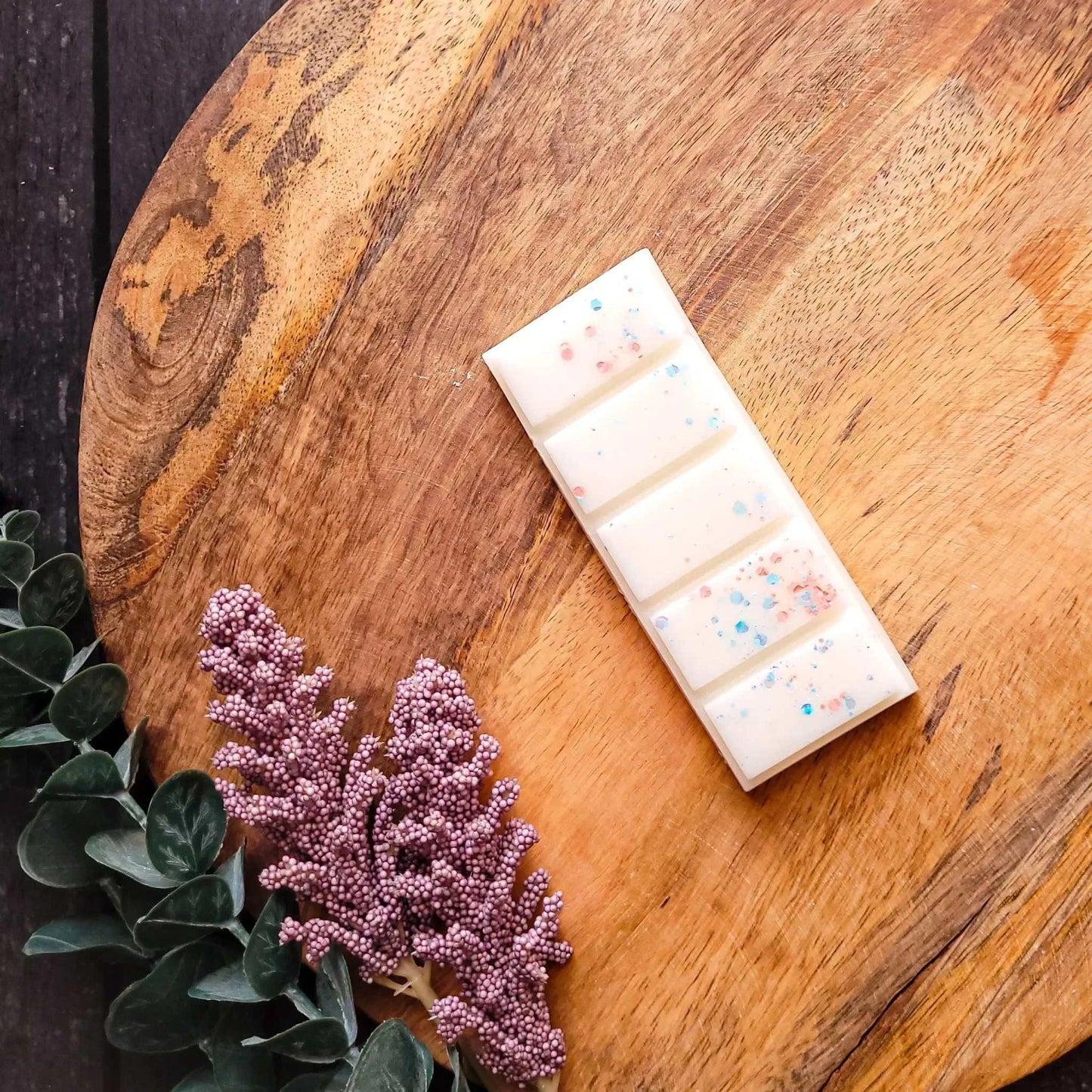 Crisp Cotton Waxmelt with green apple, cedar, and lavender on a wooden surface.