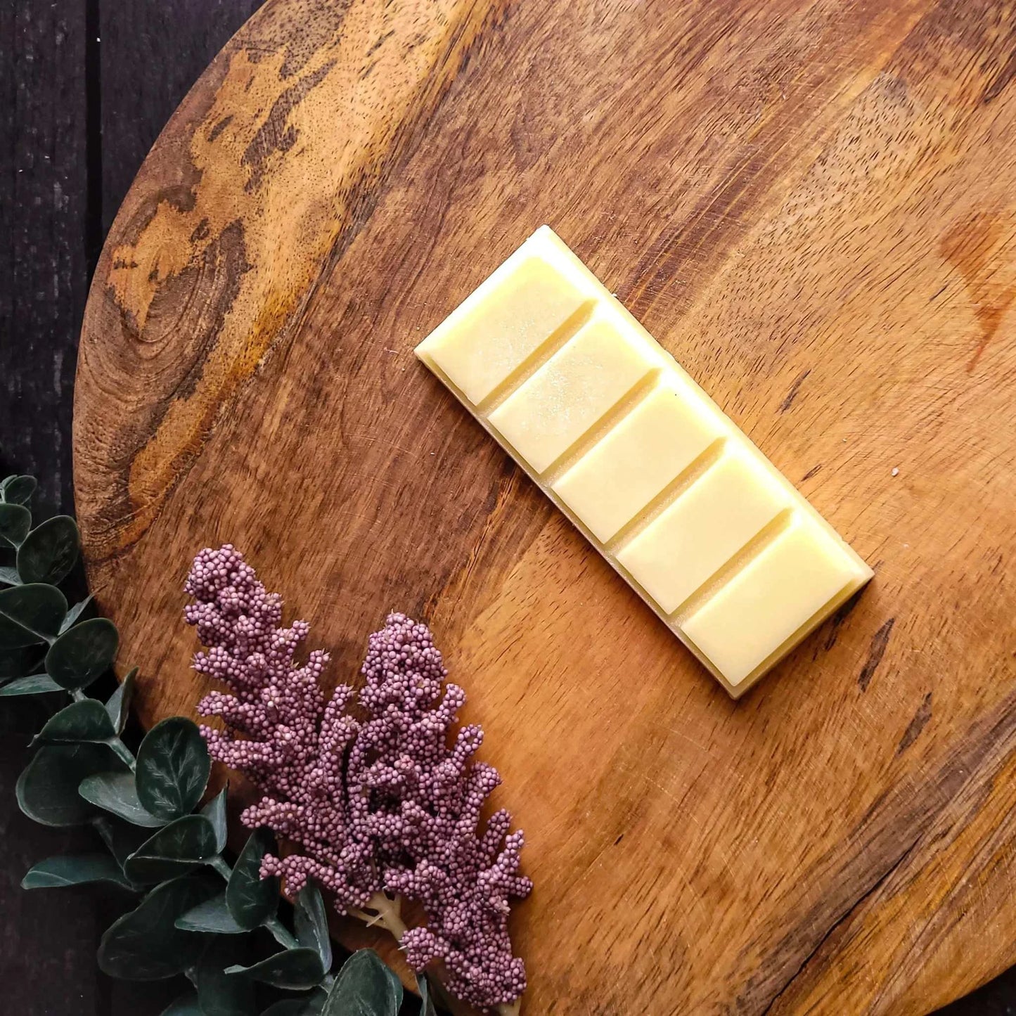 Glow Waxmelt - Wellness Range with grapefruit, chamomile, and sandalwood on wooden board. Eco-friendly soy wax.