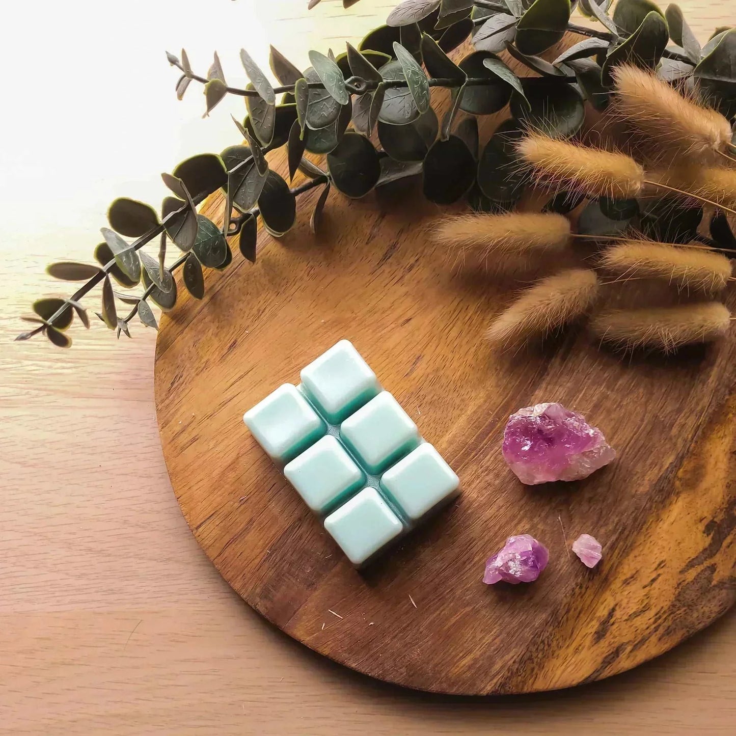 80g vegan-friendly soy wax melt pack on a wooden platter with foliage, discounted.