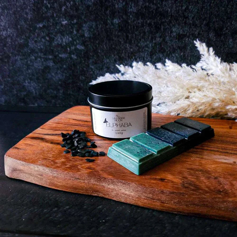 Wicked Collection Bundle - Elphaba candle and snapbar with onyx crystals on wooden surface.