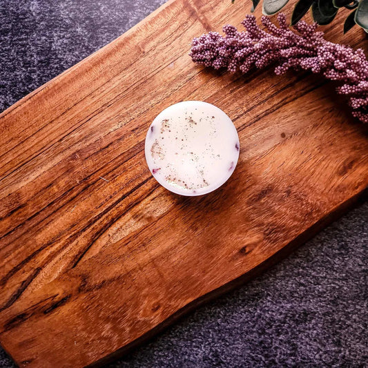 Lychee & Rose Waxmelt displayed on a wooden surface with decorative elements.