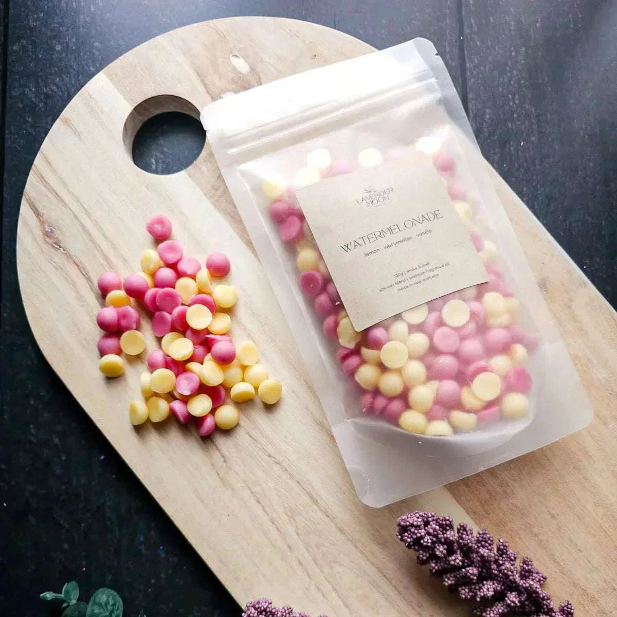 Watermelonade Waxmelt in eco-friendly packaging on a wooden board.