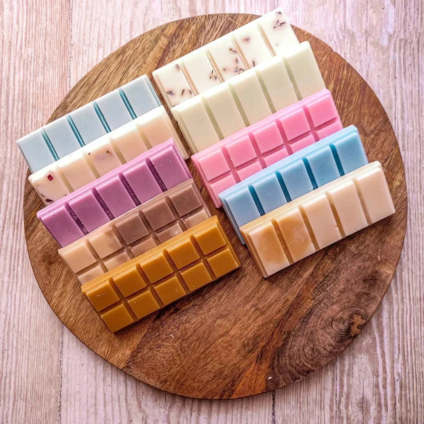 Lavender Moon 50g Snapbar 10 Pack on a wooden board, featuring multiple colors and scents, made from vegan-friendly soy wax blend with mica and biodegradable glitter.