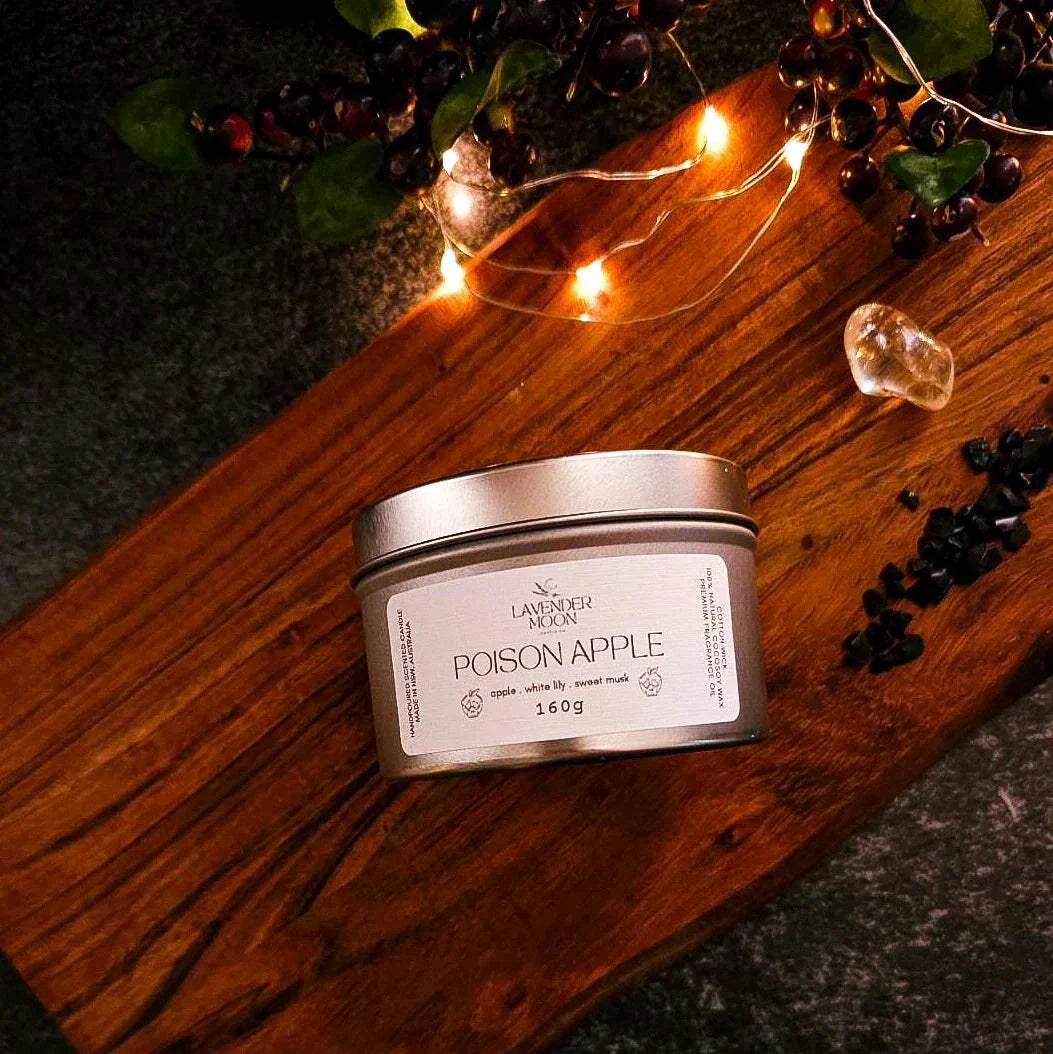 Poison Apple candle tin with green apple, white lily, and sweet musk scent, 160g, part of 2024 Halloween Collection.