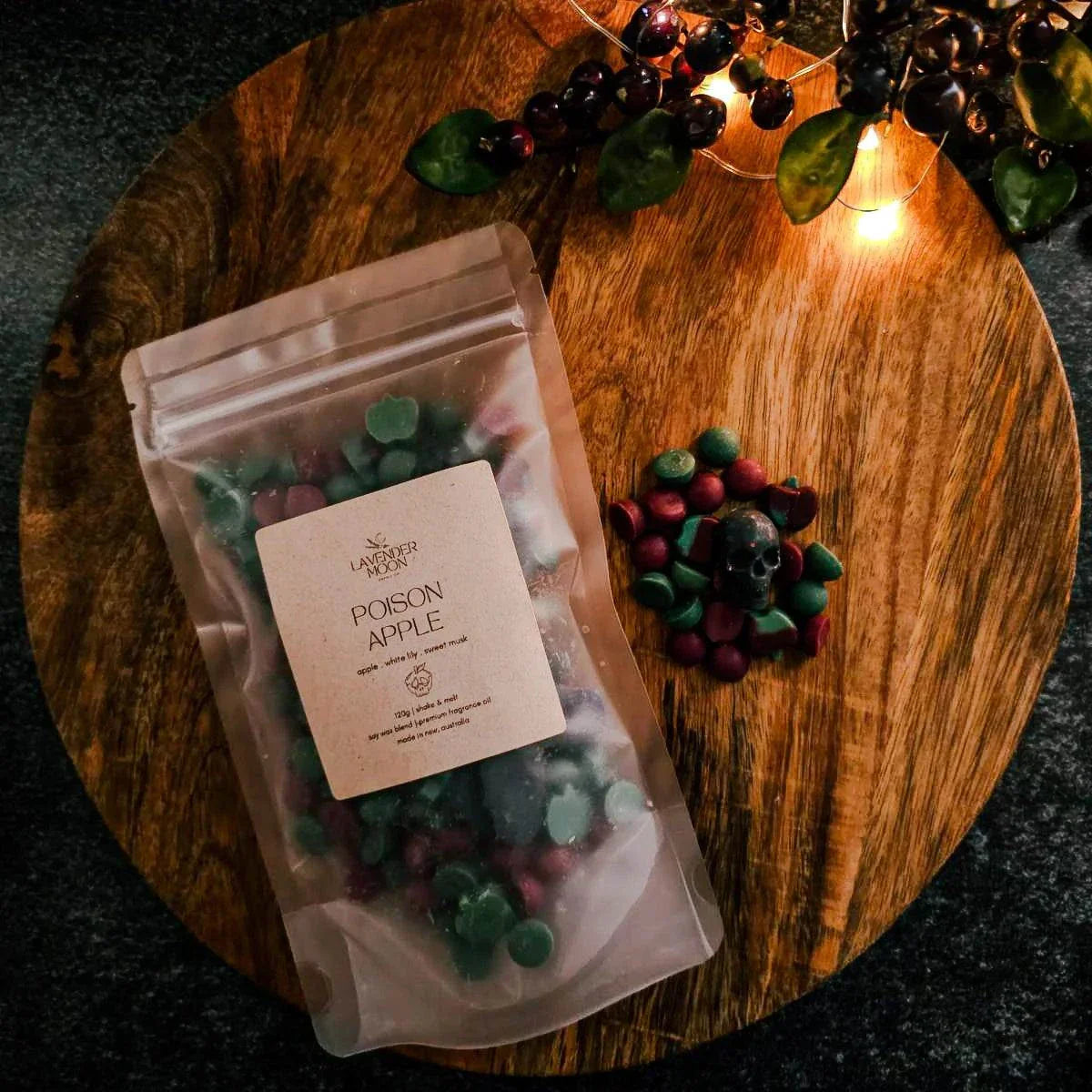 Poison Apple Waxmelt with green apple, white lily, and sweet musk scented soy wax in limited edition Halloween packaging.
